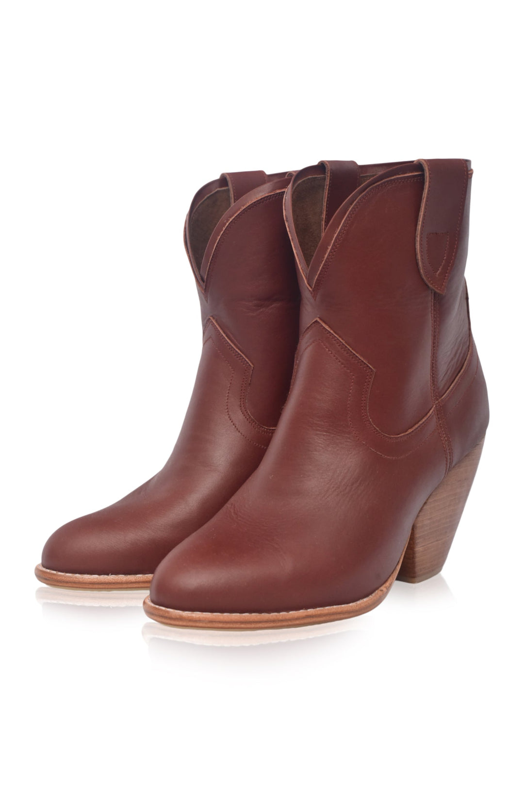 Pair of brown leather cowboy boots on a white background