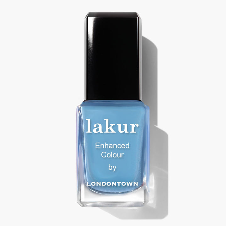 A bottle of "Hot Spring" nail polish by LONDONTOWN, reminiscent of a Pacific pool in a light blue hue, with a sleek black cap.