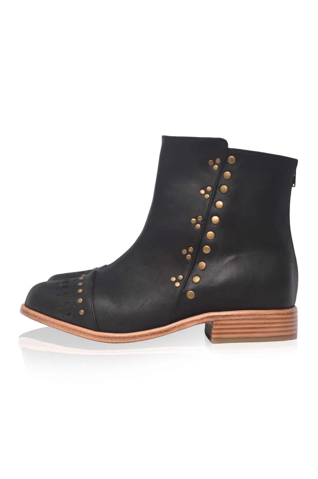 Black ankle boots with gold studs on a white background
