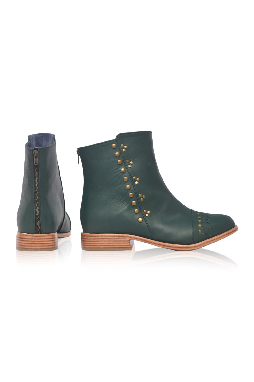 Green ankle boots with studded details on a white background