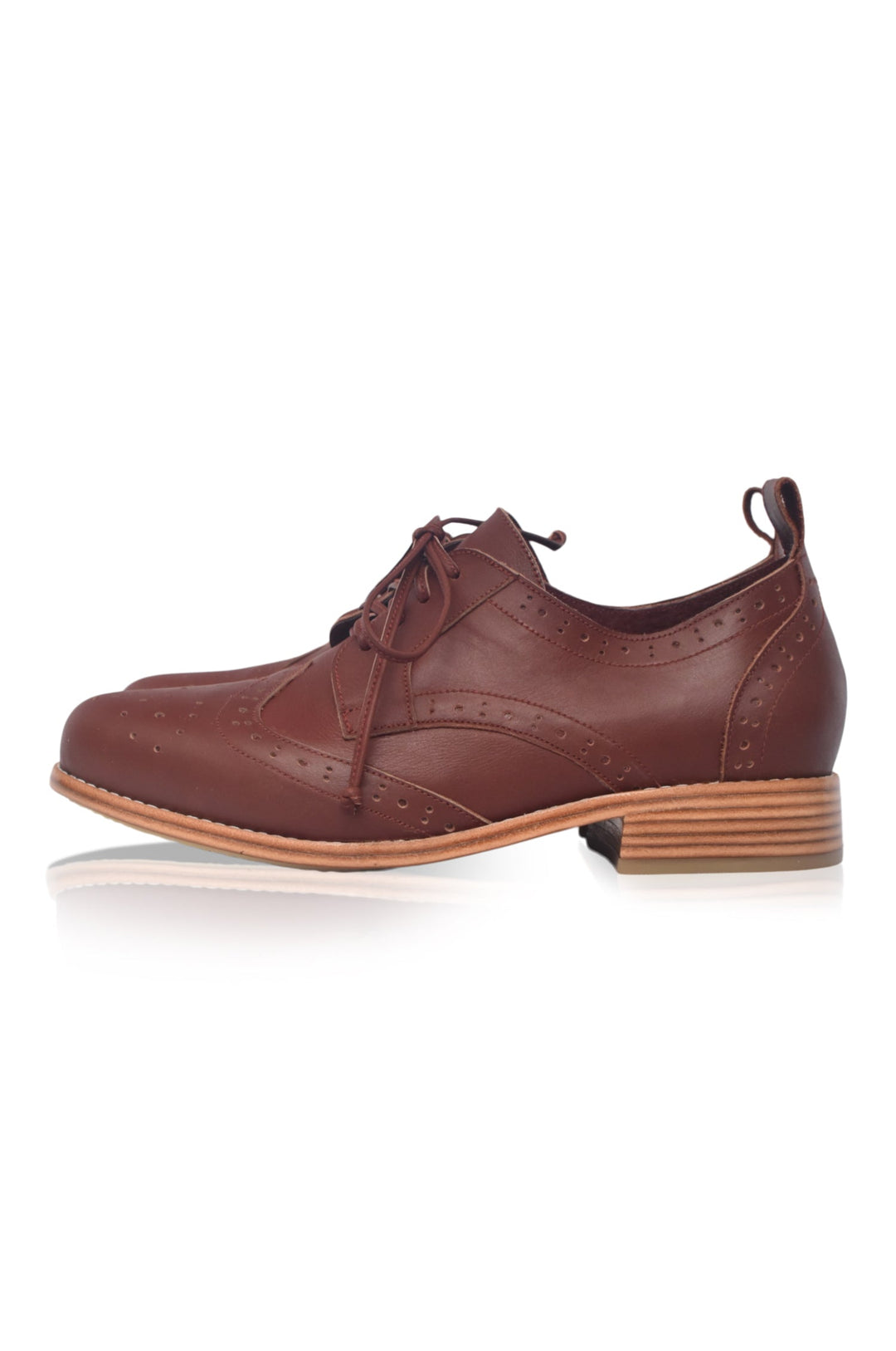 Brown leather shoe with a brown sole on a white background
