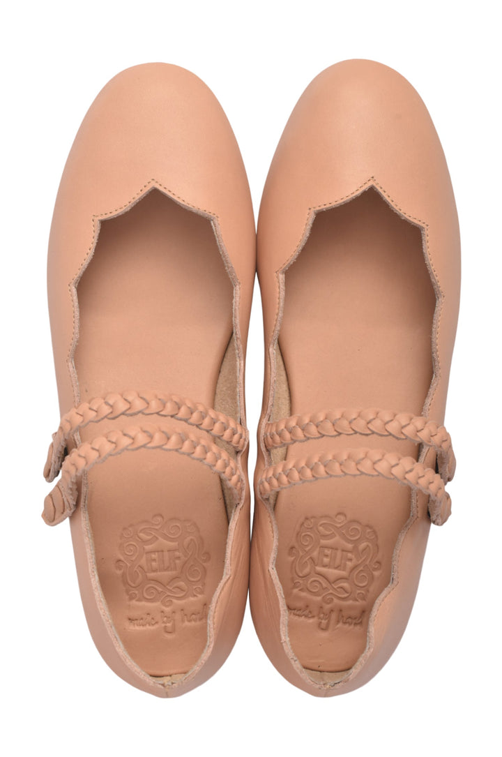 Pair of nude leather flats with braided details on the straps