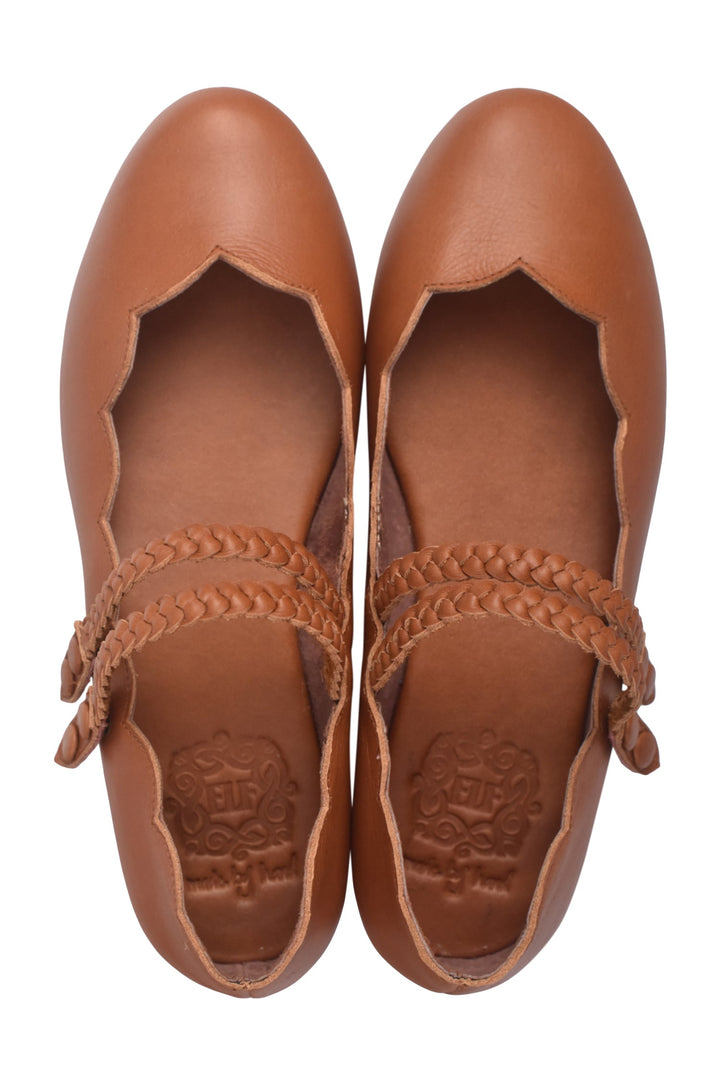 Pair of brown leather shoes with braided details on a white background