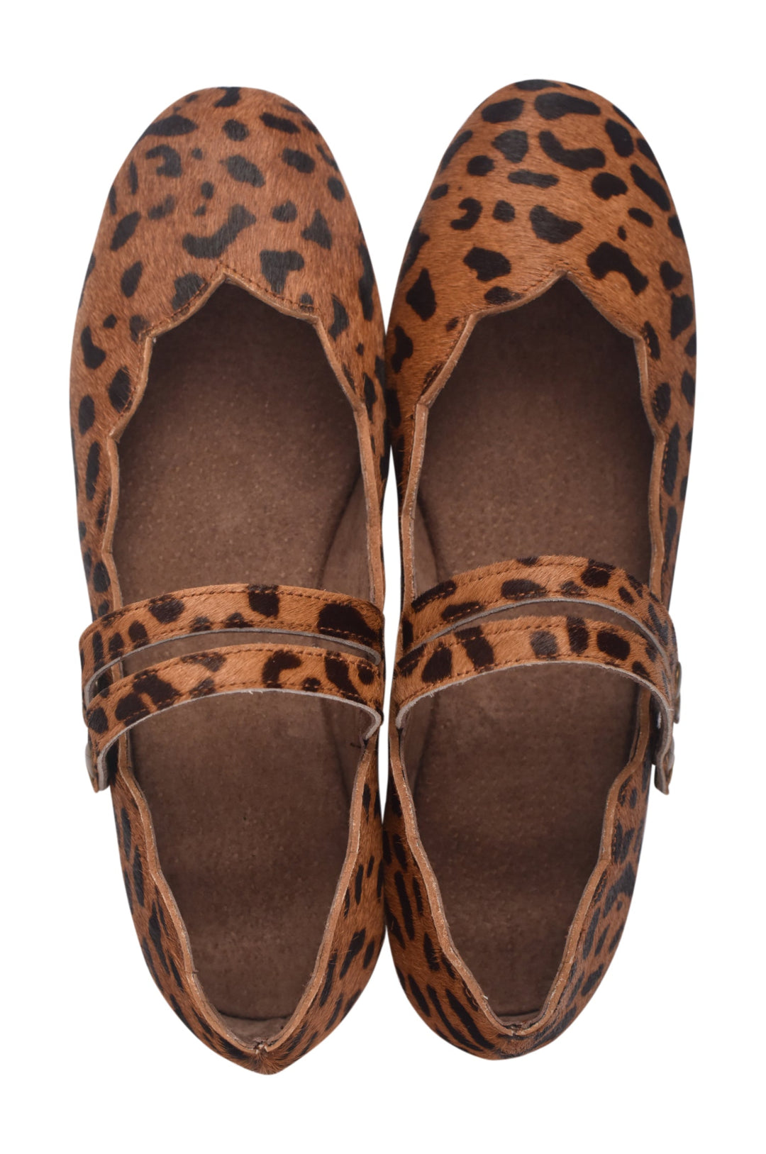 Pair of leopard print loafers on a white background