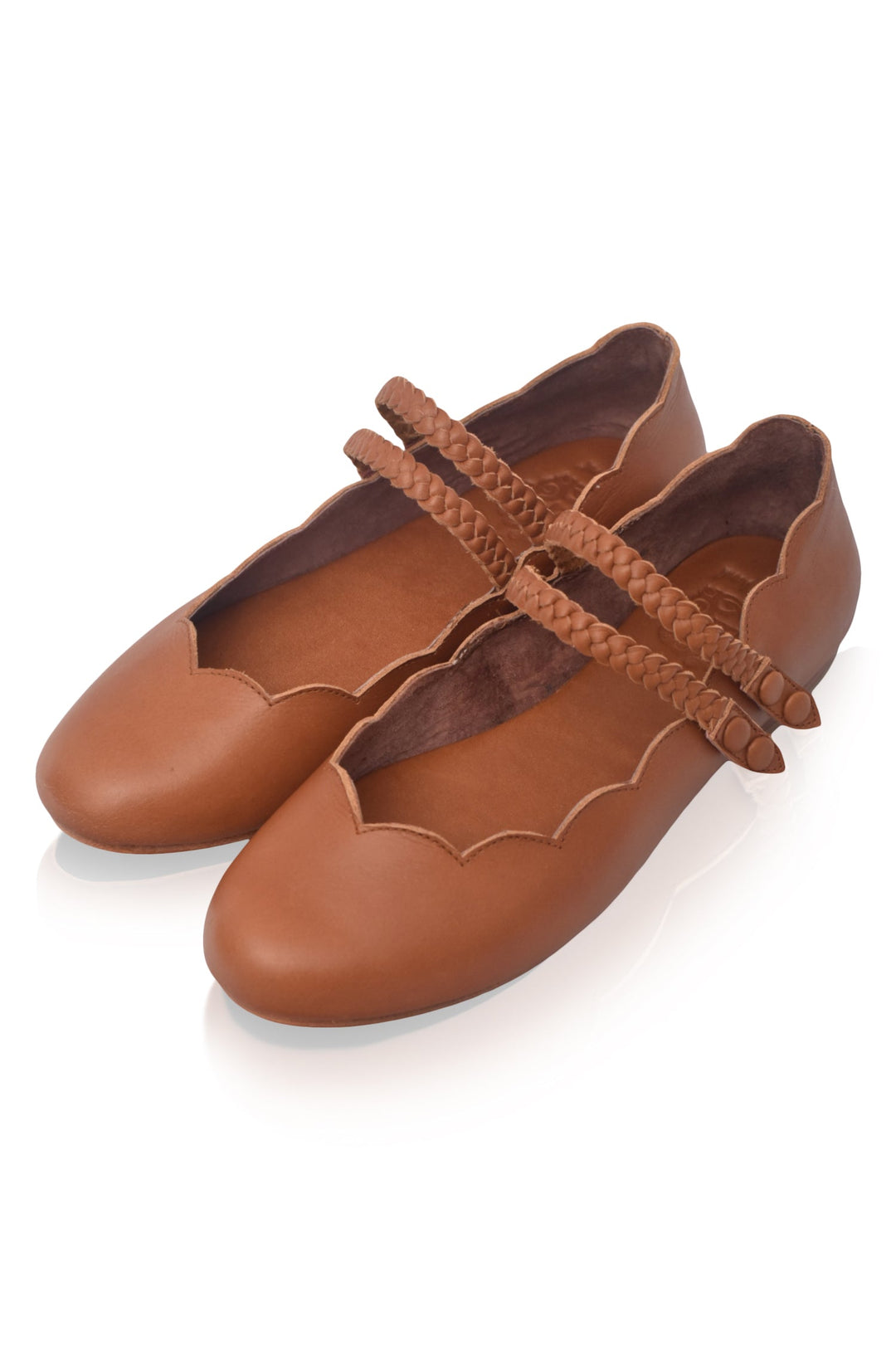 Pair of ballet flats, leather shoes with braided details on a white background
