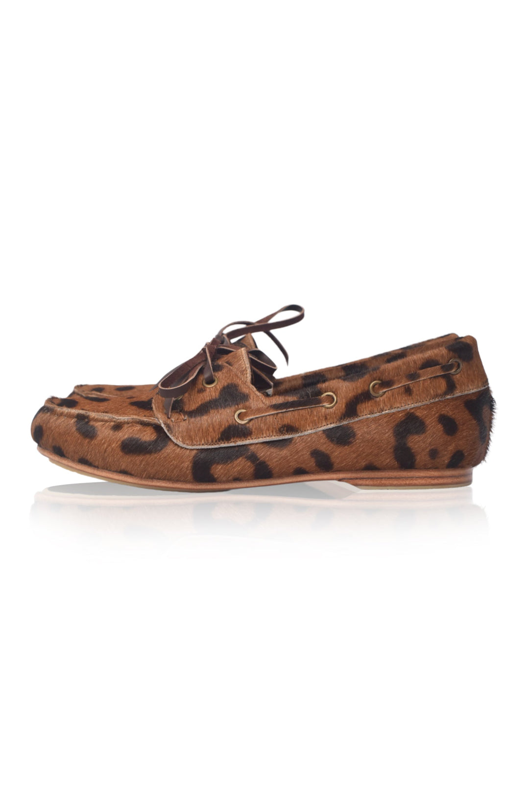 Brown boat shoe with leopard print pattern on a white background