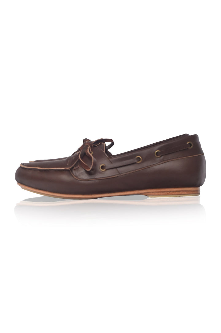 Brown leather boat shoe on a white background
