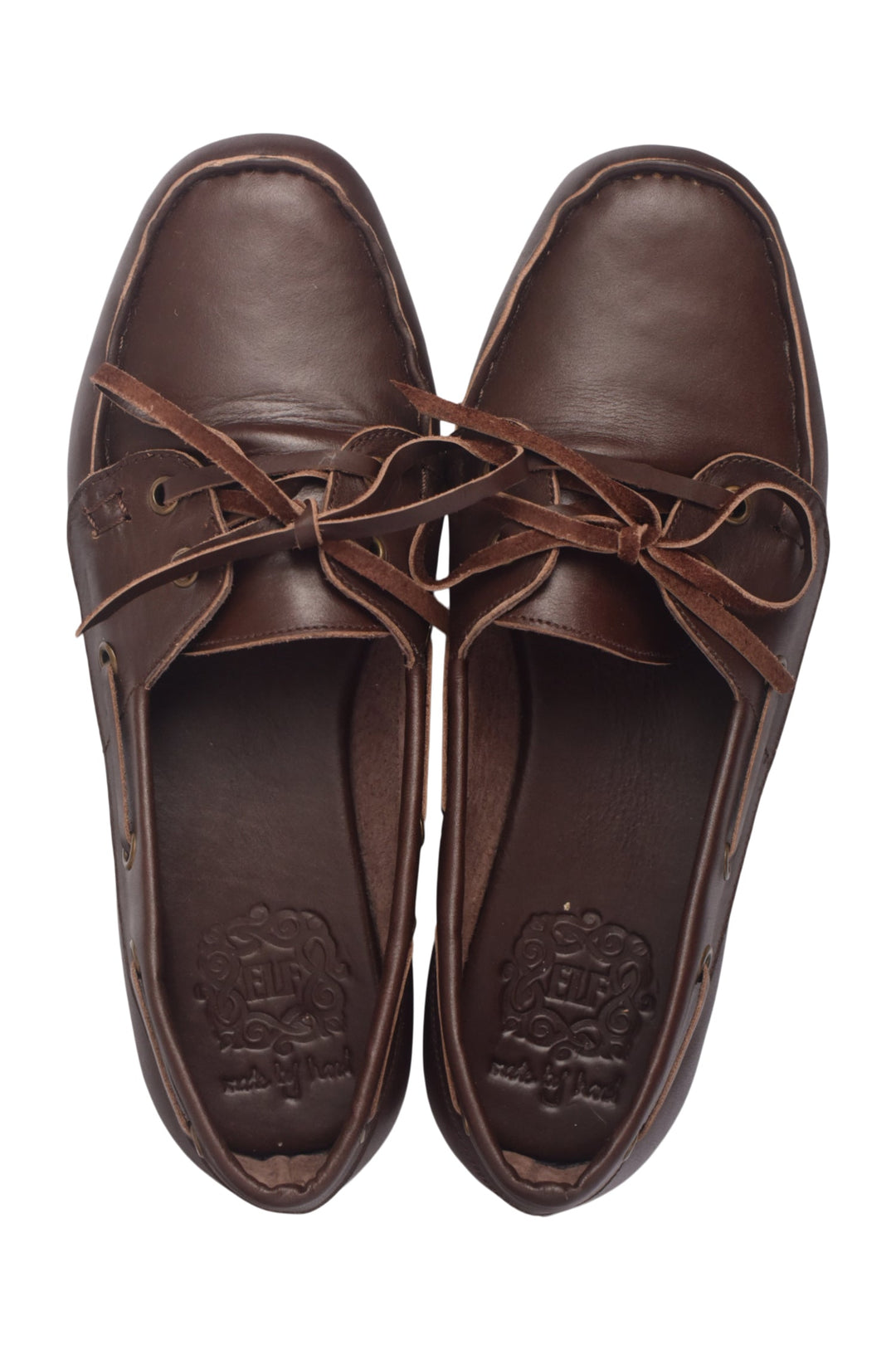 Pair of brown leather shoes with laces on a white background
