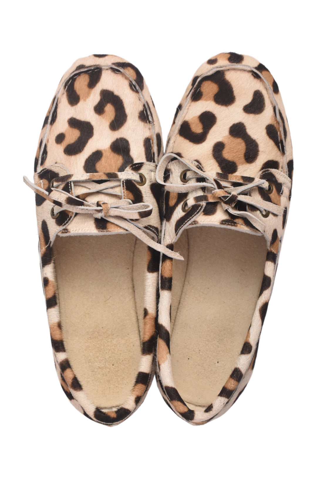 Pair of leopard print shoes on a white background