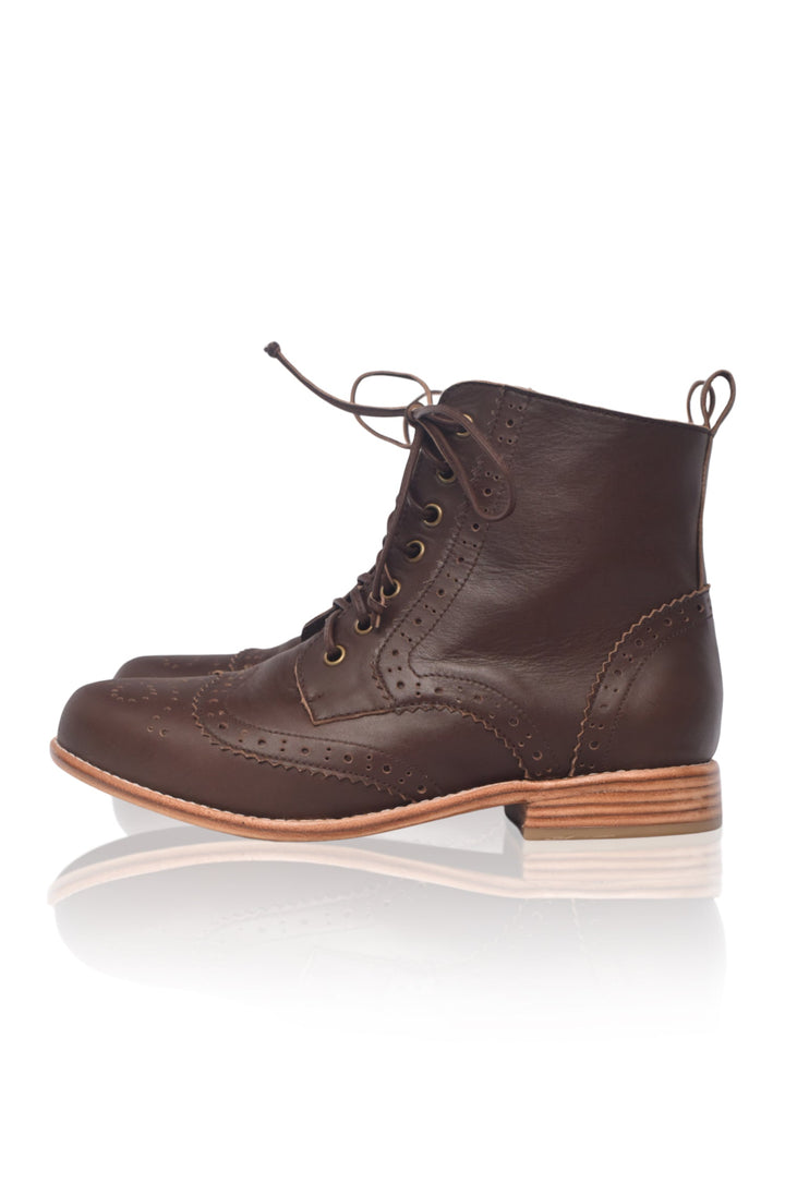 Brown leather boot on a white background