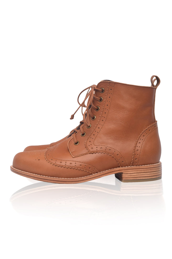 Brown leather boot on a white background