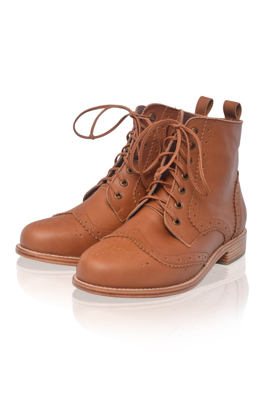 Pair of brown leather boots on a white background