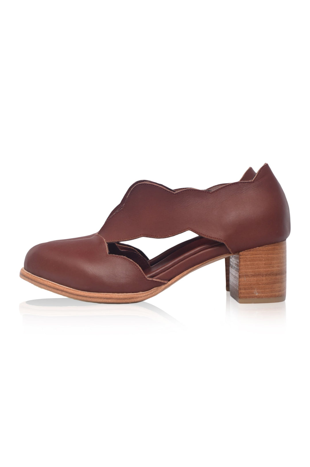 Brown leather shoe with a wooden heel on a white background