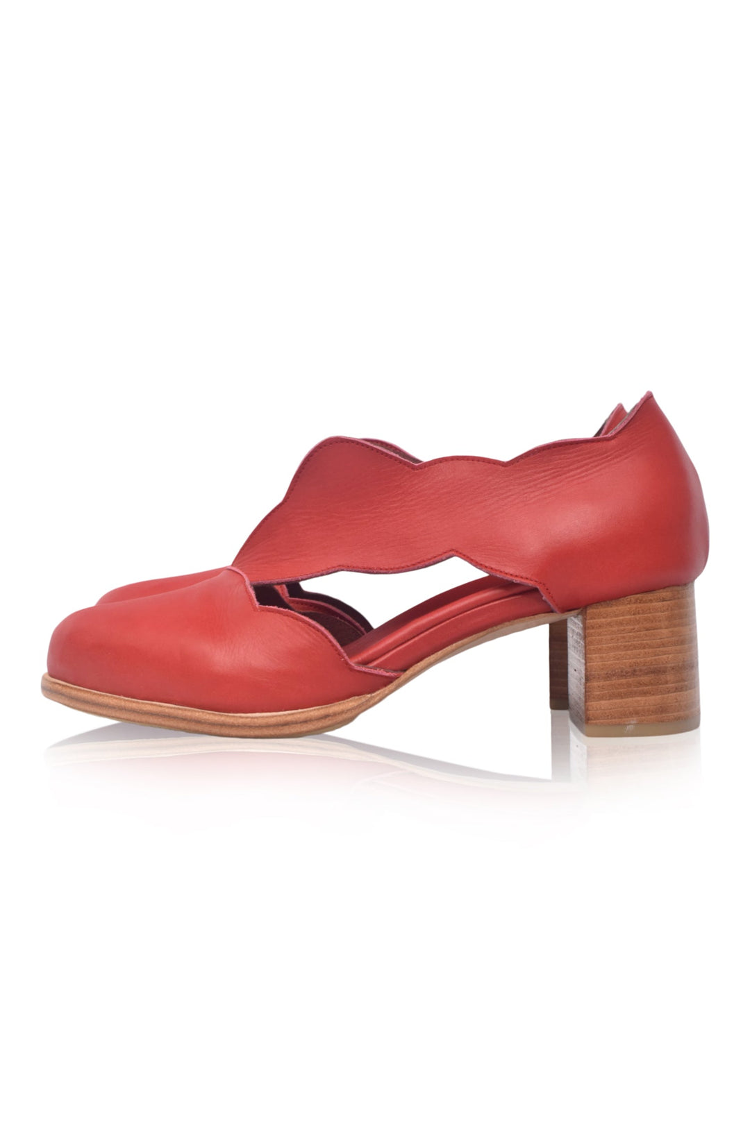 Red shoe with a wooden heel on a white background